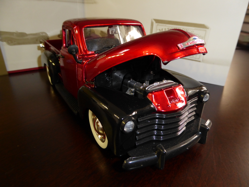Hood has opening feature and shows a decent looking engine.